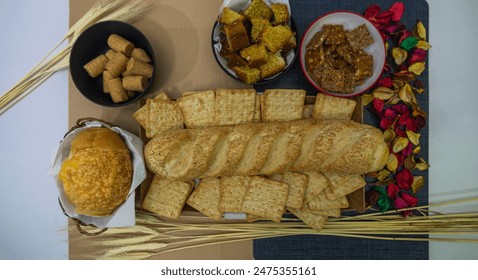 Peanuts in the shape of sweets, pacoca, cornmeal cake and peanut butter on bread