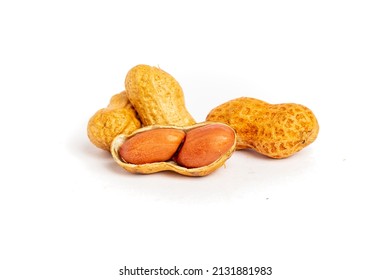 Peanuts In The Shell And A Broken Peanut On A White Background