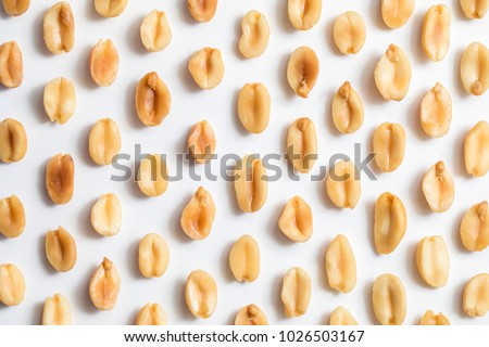 Peanuts shot Peanuts shot close up against a white backgroundclose up against a white background