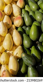 Pear And Avocado Photo Vertical. Green And Yellow