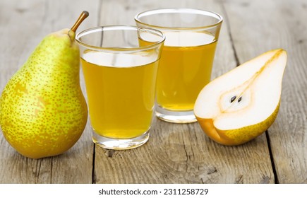 Pear juice with delicious pears - Shutterstock ID 2311258729