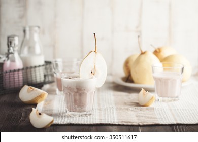 Pear smoothie with strawberry cedar milk in glass
