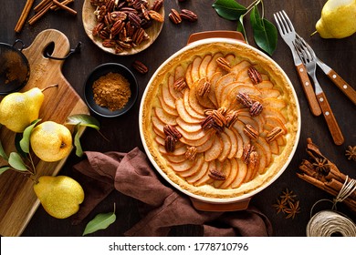 Pear tart, pie or cake with fresh pears, cinnamon and pecan nuts - Powered by Shutterstock