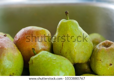 Pear texture: lots of pears collected in a bowl. Pear storage