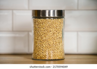 Pearl Barley Raw Grains In A Glass Jar On White Background. Pot Barley Grains, Close-up. Raw Grain. Groats Jar. Porridge In A Glass Bowl. Raw Barley Groats. Fresh Groats In A Jar. Porridge Grains Jar