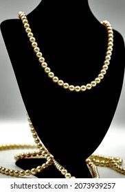 Pearl Chain Shot On A Velvet Silhouette