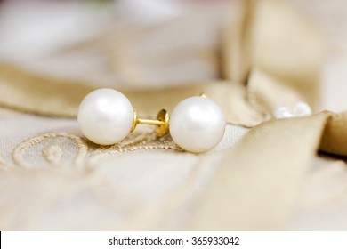 Pearl Earring On Blur Background