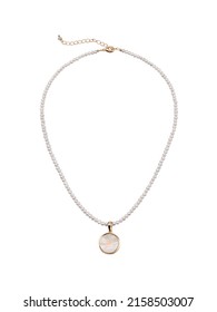 Pearl golden necklace with white round pendant isolated on white backround. Top view 