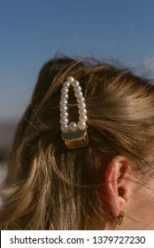 Pearl Hairpin In The Hair Of A Blonde Girl. Stylish Barrette