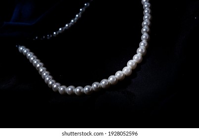 Pearl necklace, Pearl necklace against a dark background