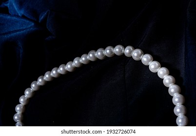 Pearl necklace, Pearl necklace against a dark background