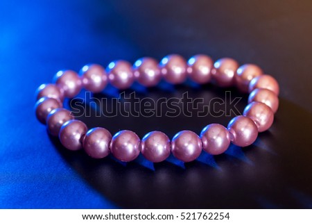 Pearl necklace isolated on dark background