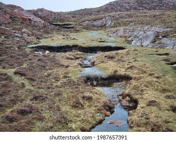 Peat Erosion And Flowing Water In A Wetland Area On Muckle Roe, Shetland, UK