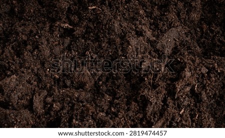 Peat soil textured background. Compost pile, brown garden dirt mound, humus earth for agriculture, organic ground topsoil, peat mud for plants and flowers
