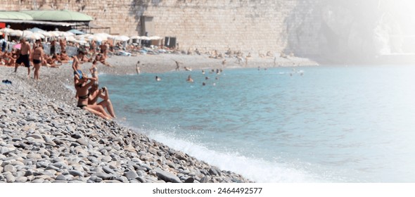 pebble beach - Promenade des Anglais, Nice, French Riviera - Powered by Shutterstock