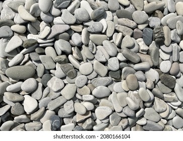 Pebble Round Stones For Meditation On Blurred Abstract Background. Rounded Pebble Stones For Meditation Laying On Seacoast. Spa Stones, Zen Like Concept. Pile Of Circle Stones High Quality Photo.