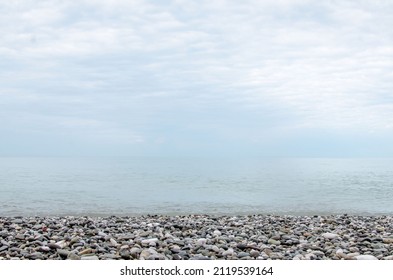 Pebble Round Stones For Meditation On Blurred Abstract Background. Rounded Pebble Stones For Meditation Laying On Seacoast. Spa Stones, Zen Like Concept. Pile Of Circle Stones High Quality Photo.