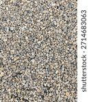 Pebble stone in the ground as a background texture pattern.