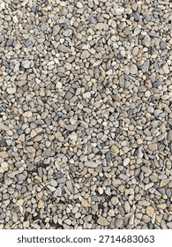 Pebble stone in the ground as a background texture pattern.