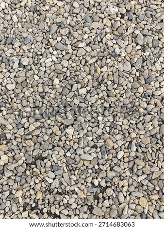 Pebble stone in the ground as a background texture pattern.