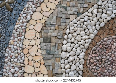 Pebble stone wall texture background or texture, close up. Building facade decoration - Shutterstock ID 2244431745