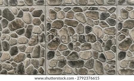 Pebble stone wall texture, river rock mosaic tile pattern background for spa and garden decor