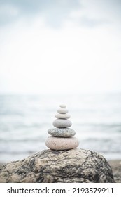 Pebble Tower Balance Harmony Stones Arrangement On Sea Beach Coastline. Relaxing Peaceful Formation Pyramid Cobblestone Philosophy Equilibrium Spiritual Tranquility. Spa Therapy Summer Travel Vacation