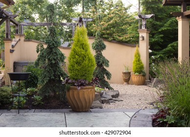 A Pebbled Walkway At The Entrance To A Backyard Retreat Filled With Perennials  Inspired By Tuscany.