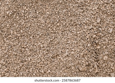 Pebbles background. Top view of river stones shingle , mineral material for pathways in modern urban garden or construction site