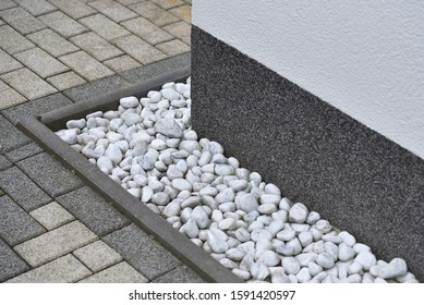 Pebbles For Drainage Of Water Along The House Next To The Wall. Rainwater Harvesting