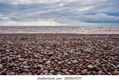 Pebbles On A Isolated Beach, Multicoloured And Textured. Thought Provoking, Calming And Peaceful.