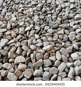 Pebbles are small rocks, usually broken granite. Gravel is often used in the construction of road bodies, and as a mixed stone to produce bricks.