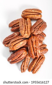 Pecan Caramelized. Caramelized pecans on a white plate. Fried pecan.