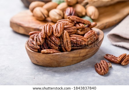 Pecan nut unshelled. Pecans are rich in various trace elements and vitamins 商業照片 © 