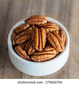 Pecan Nuts In Wood Bowl