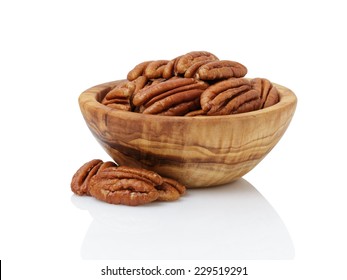 pecan nuts in wood bowl, isolated on white background