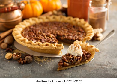 Pecan pie topped with whipped cream for Thanksgiving