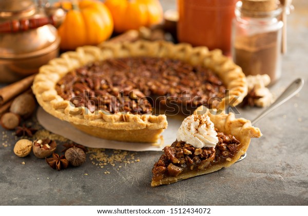 Pecan pie\
topped with whipped cream for\
Thanksgiving