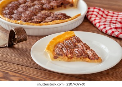 Pecan Pie - Traditional Southern US Dessert On Wooden Table