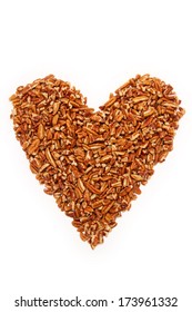 Pecan Pieces In Heart Shape On White Background