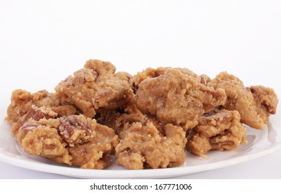 Pecan Pralines On White Platter Against White Background