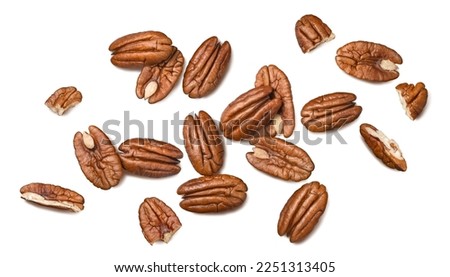 Pecans isolated on white background. Nuts scattered. Top view. Horizontal layout.  Package design element with clipping path 商業照片 © 