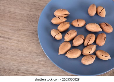 Pecans on the plate on table