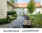 Pecs, Hungary - October 6, 2018: Zsolnay Museum courtyard with sculptures of lions, deer, elephants and a blue vase in Pecs Hungary.