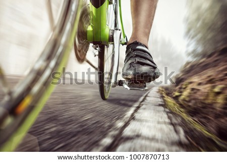 Pedal of a fast moving racing bicycle