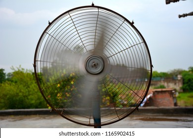 Pedestal Fan Blowing On Roof