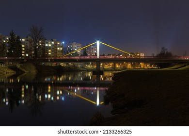 Pedestrain bridge above river Vltava in city Ceske Budejovice at night. Long exposure, Czech republic