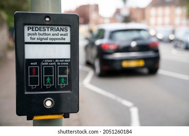 Pedestrains push button and wait for signal opposite at crosswalk, Traffic light at square in urban or city