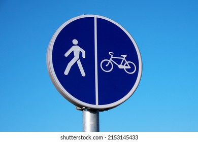 Pedestrian And Bike Path Sign Against The Sky.