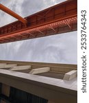 a pedestrian bridge to the LRT station with the sky as a background